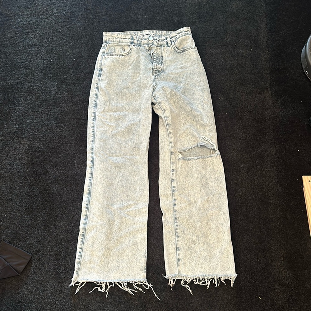 Zara light blue jeans with rip in left knee